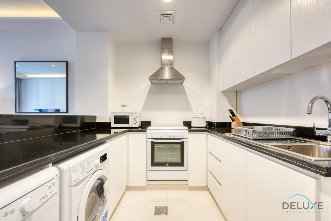 Sleek 1br At Celestia South By Deluxe Homes Lägenhet *