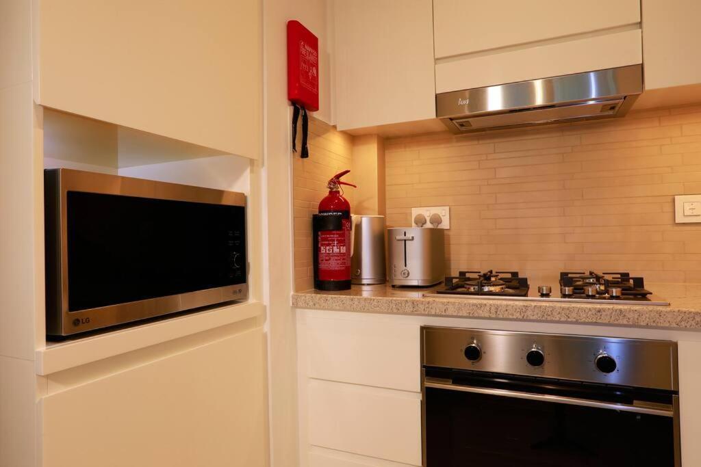 Modern And Spacious 1 Bedroom With Direct Access To Mall Ultima Vacation Homes 02 Apartment